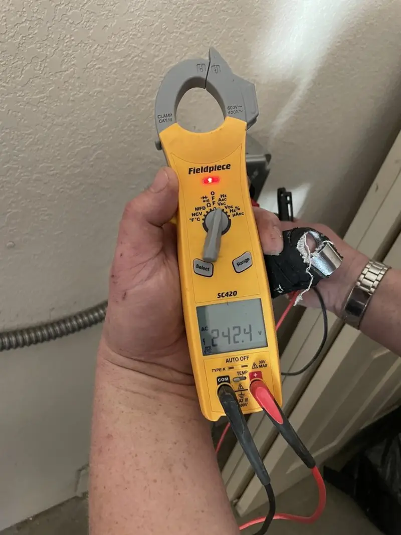 Voltage testing with clamp meter during Recessed Lighting Installation in Warrenton